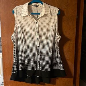Women cream top with black polka dots.